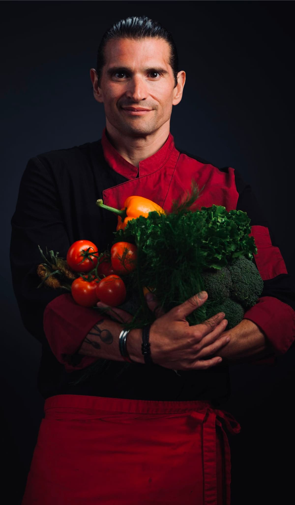 A BioChef holding fresh vegetables